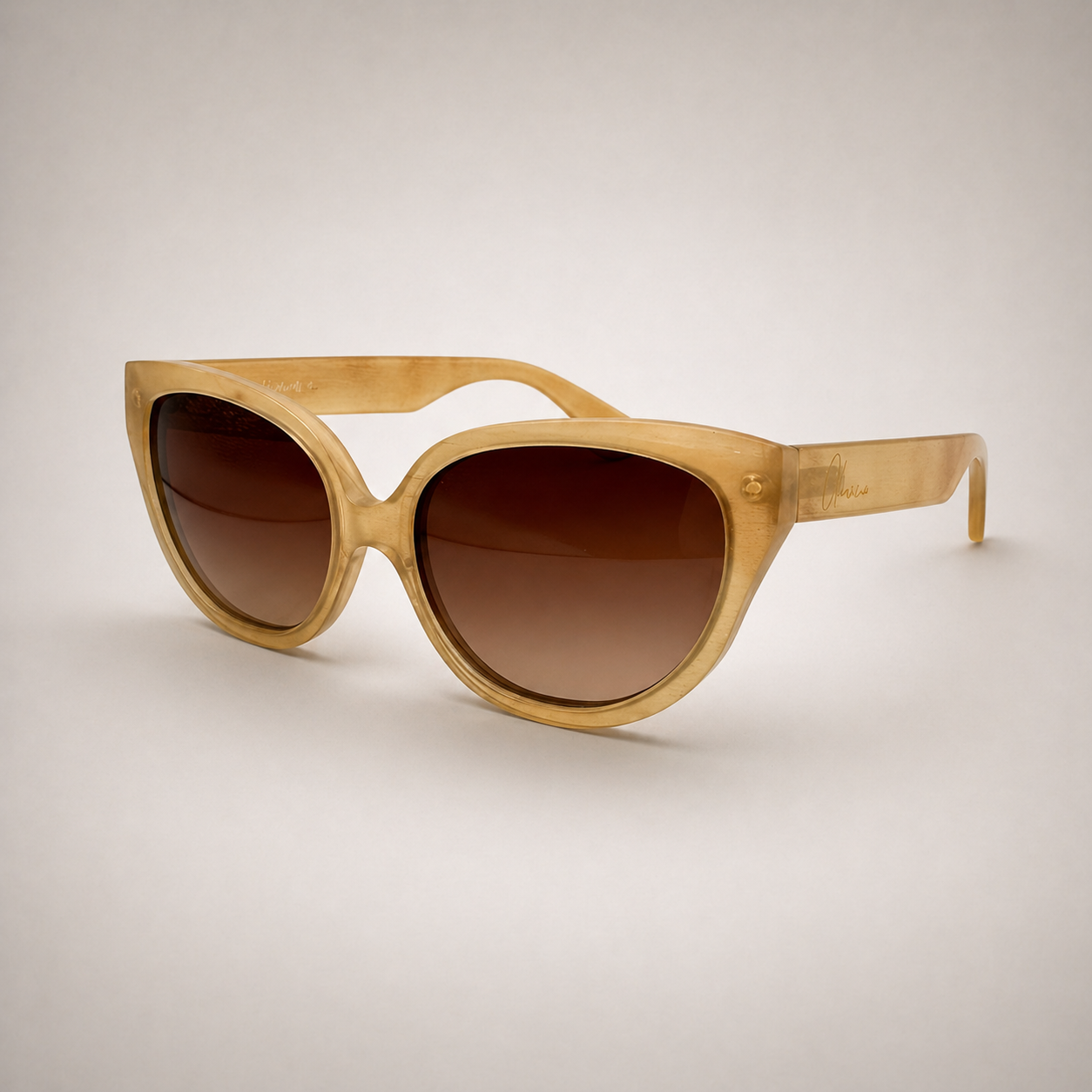 Olivencia LYRA · VELA handcrafted honey horn sunglasses in angled view with gradient brown lenses.