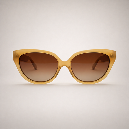Olivencia LYRA · VELA handcrafted honey horn sunglasses with gradient brown lenses.