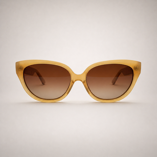 Olivencia LYRA · VELA handcrafted honey horn sunglasses with gradient brown lenses.