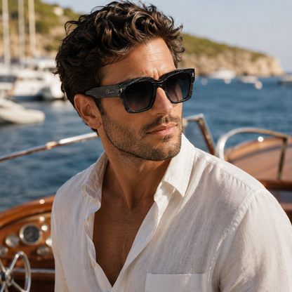 Man wearing Olivencia ORIAN · LINEA handcrafted black horn sunglasses with rare white-line pattern and gradient black lenses.